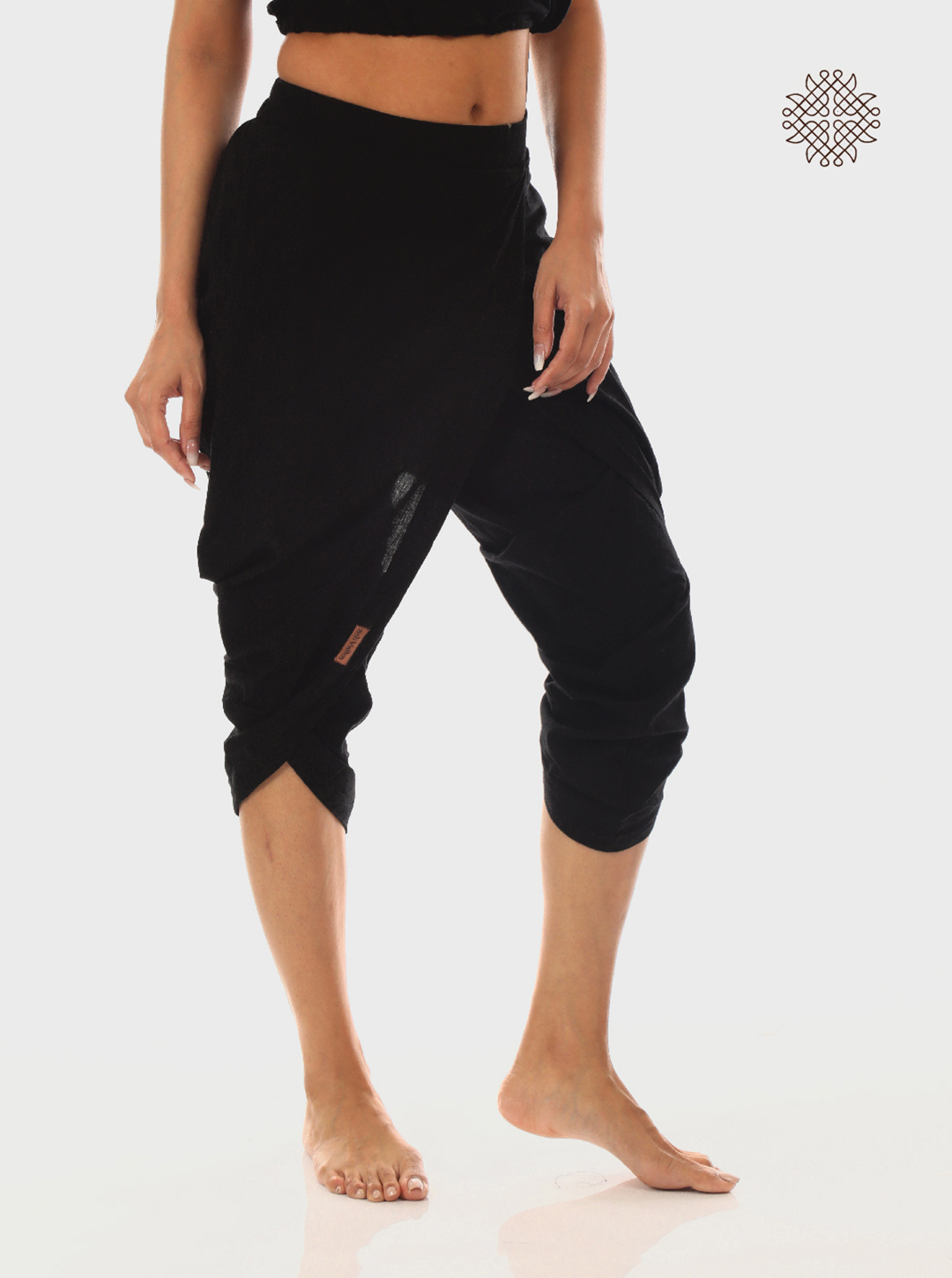 syamah (black) taruNi, cross-cut calf length dhoti pants with pockets crafted in 100% cotton