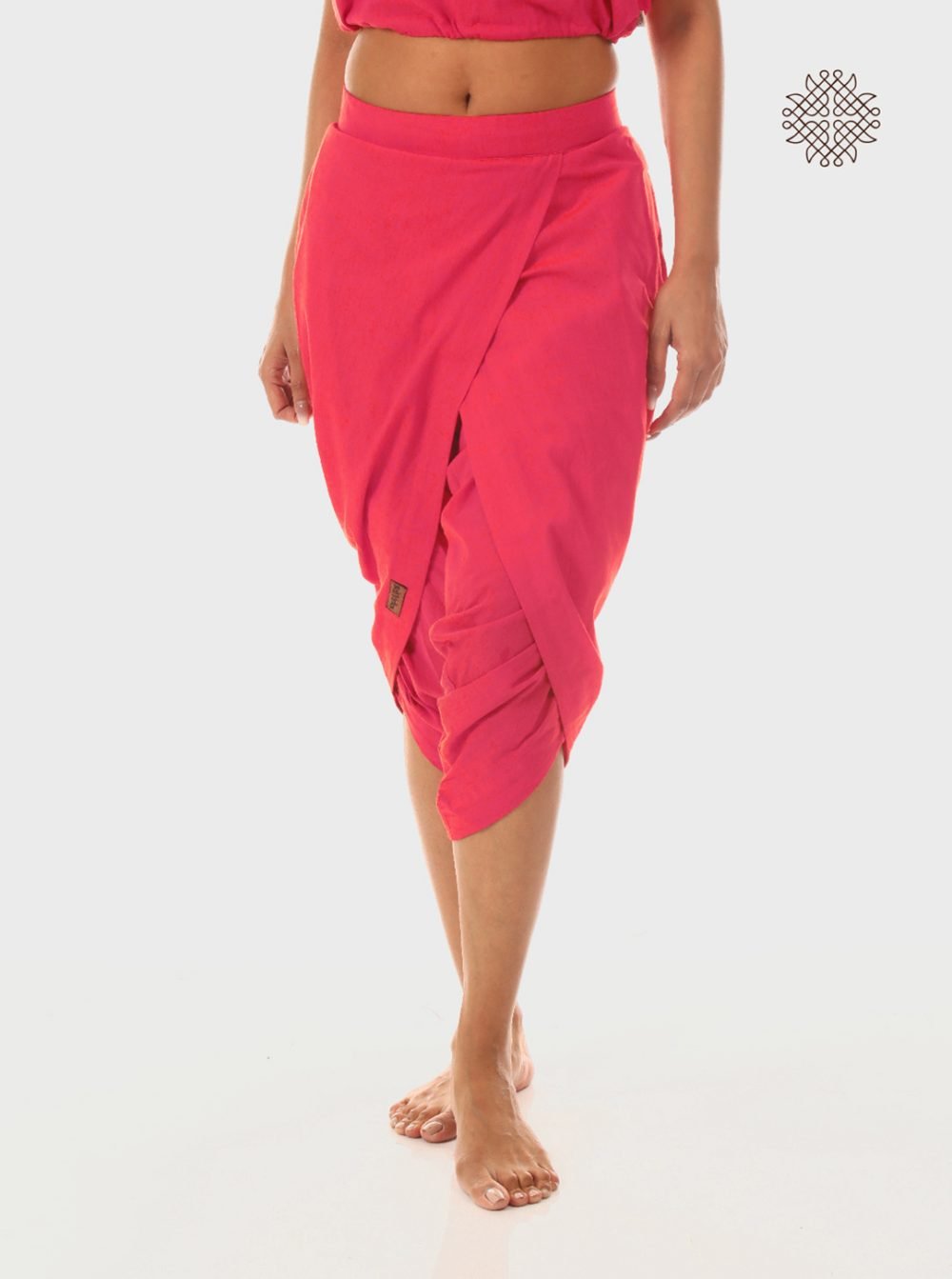 pAtala (coral pink) taruNi, cross-cut calf length dhoti pants with pockets crafted in 100% cotton